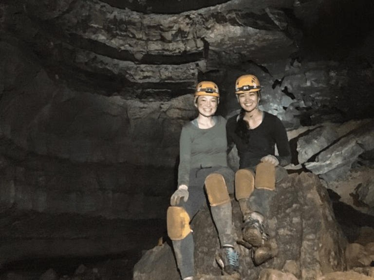 Women Exploring Cavern