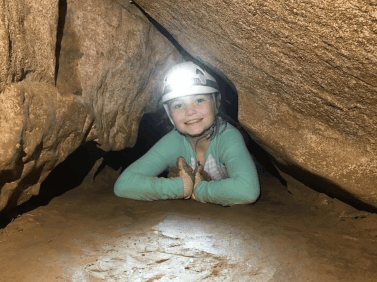Young Girl Exploring Cavern